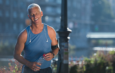 Image showing portrait of handsome senior jogging man