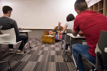 Image showing teacher with a group of students in classroom