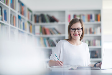 Image showing female student study in school library