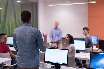 Image showing student answering a question in classroom