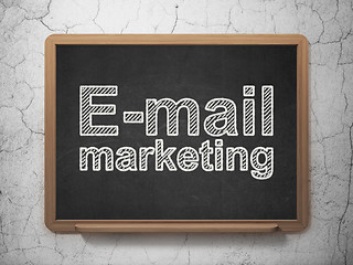 Image showing Advertising concept: E-mail Marketing on chalkboard background