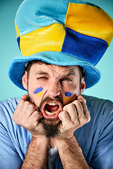 Image showing The football fan over blue