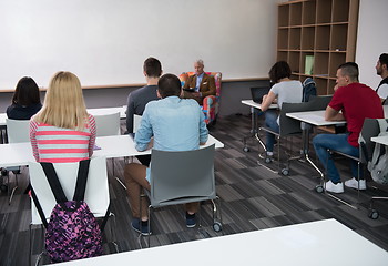 Image showing teacher with a group of students in classroom