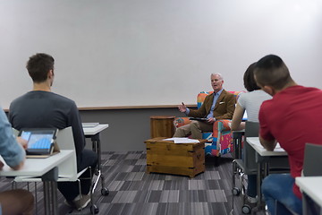 Image showing teacher with a group of students in classroom