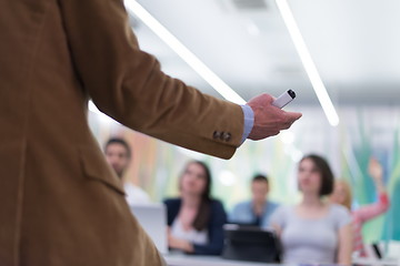 Image showing close up of teacher hand while teaching in classroom