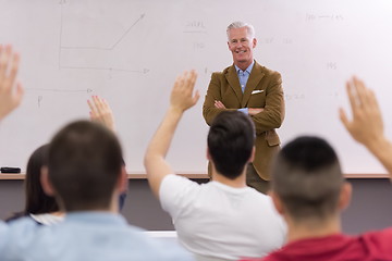 Image showing teacher with a group of students in classroom