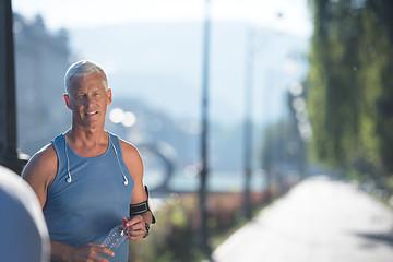 Image showing portrait of handsome senior jogging man