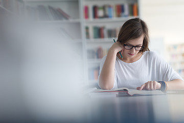 Image showing female student study in school library