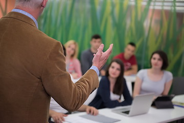 Image showing teacher with a group of students in classroom