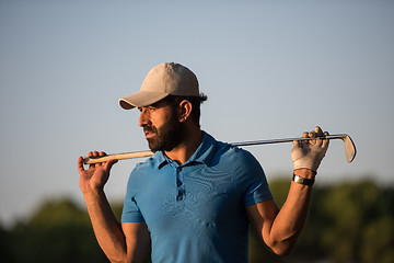 Image showing golfer  portrait at golf course on sunset