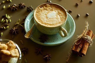 Image showing Cup of hot latte coffee on table