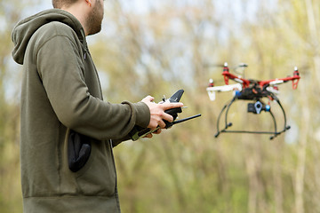 Image showing Man controling a drone.