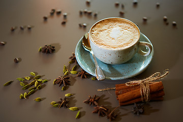 Image showing Cup of hot latte coffee on table