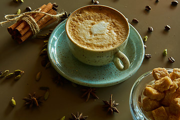 Image showing Cup of hot latte coffee on table