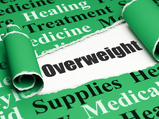 Image showing Medicine concept: black text Overweight under the piece of  torn paper