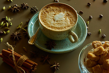 Image showing Cup of hot latte coffee on table