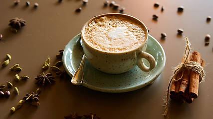 Image showing Cup of hot latte coffee on table