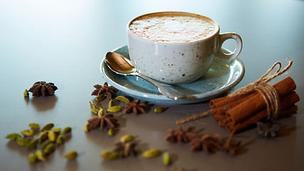 Image showing Cup of hot latte coffee on table