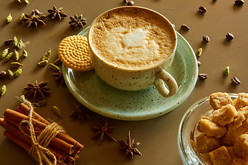 Image showing Cup of hot latte coffee on table