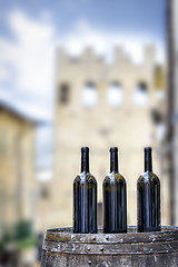 Image showing Winte bottles on a barrel