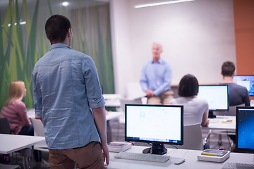 Image showing student answering a question in classroom