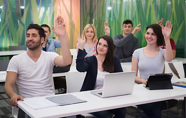 Image showing teacher with a group of hi school students in classroom