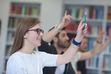 Image showing group of students  raise hands up