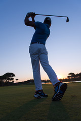 Image showing golfer hitting long shot