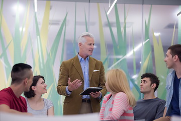 Image showing teacher with a group of students in classroom