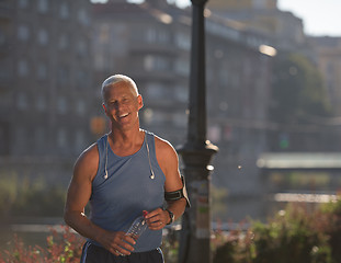 Image showing portrait of handsome senior jogging man