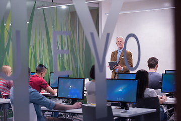 Image showing teacher and students in computer lab classroom