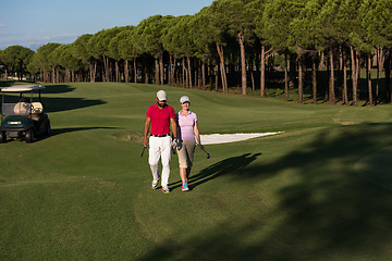 Image showing couple walking on golf course