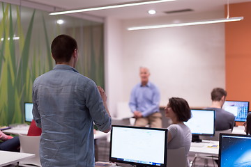 Image showing student answering a question in classroom