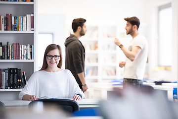 Image showing female student study in school library, group of students in bac