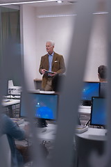 Image showing teacher and students in computer lab classroom