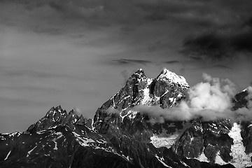 Image showing Black and white mountains in clouds