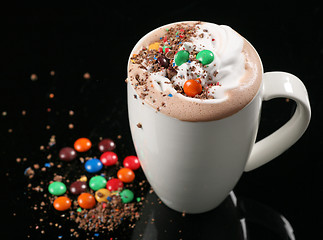 Image showing hot chocolate drink with whipped cream and candies