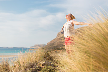 Image showing Free Happy Woman Enjoying Sun on Vacations.