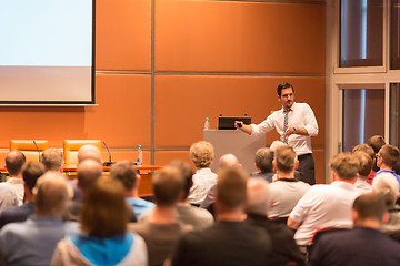 Image showing Business speaker giving a talk in conference hall.