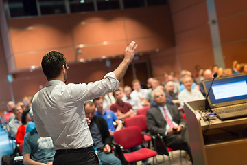 Image showing Public speaker giving talk at Business Event.