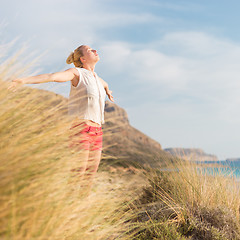 Image showing Free Happy Woman Enjoying Sun on Vacations.