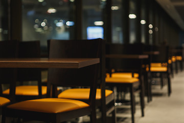 Image showing rows of tables and chairs in the cafe