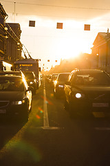 Image showing the cars and the trolley are on the traffic light