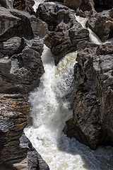 Image showing Waterfall Flowing Between the Lava Stones