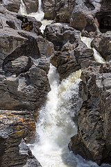 Image showing Waterfall Flowing Between the Lava Stones