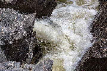 Image showing Waterfall Flowing Between the Lava Stones