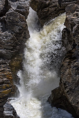 Image showing Waterfall Flowing Between the Lava Stones