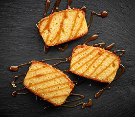 Image showing biscuit cake slices with sweet caramel sauce