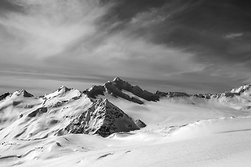 Image showing Black and white view on off-piste slope at sun evening