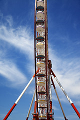 Image showing Ferris wheel and blue sky with clouds